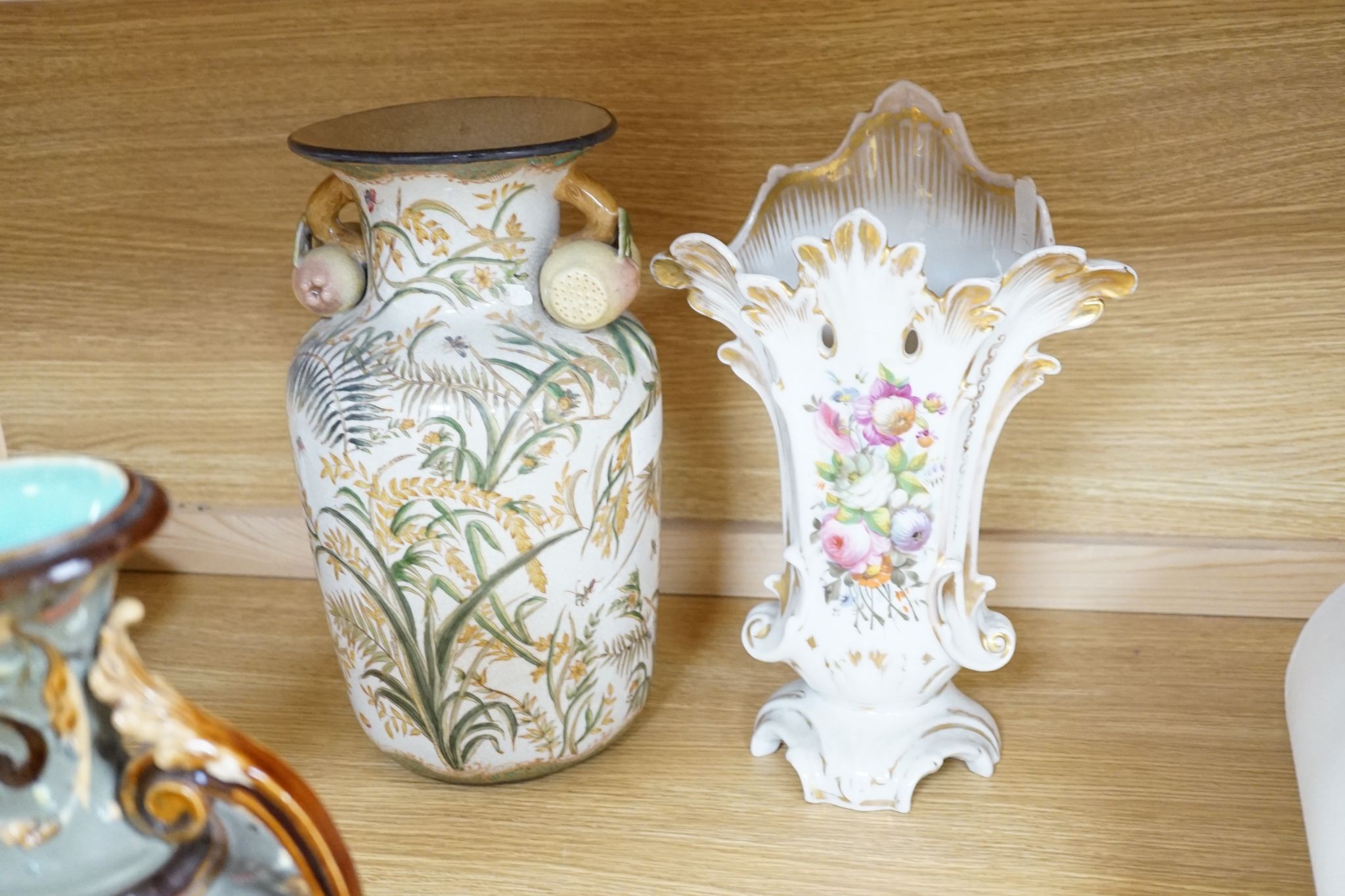 Four pairs of continental porcelain vases including a pair of Wilhelm Schiller & Sons vases